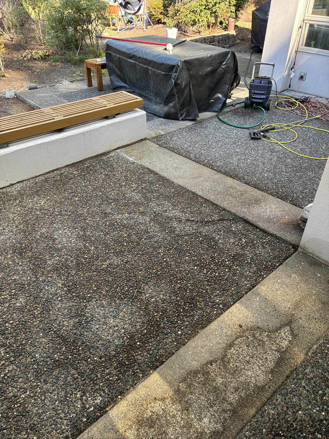 Backyard concrete patio before pressure washing